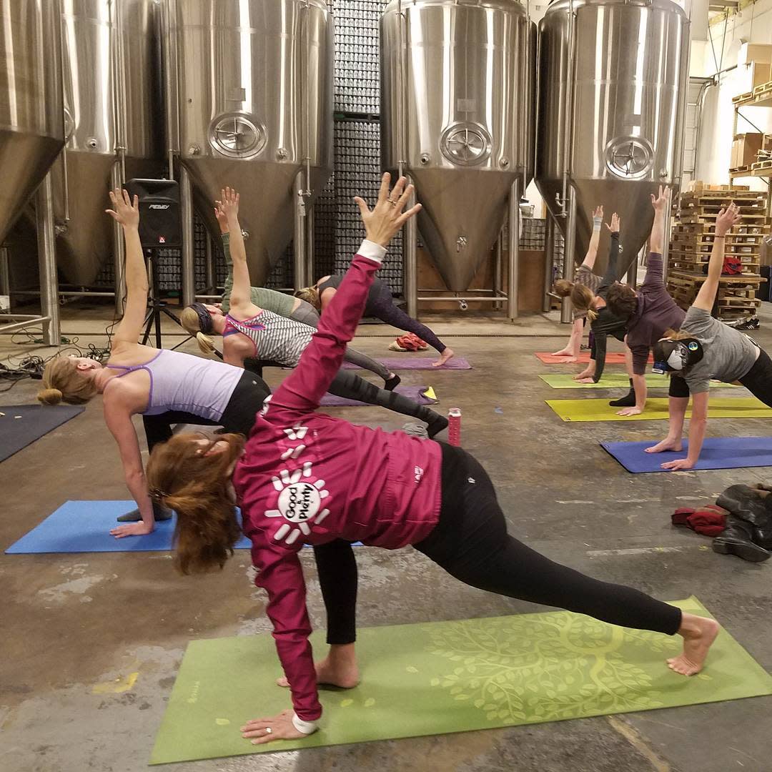 People doing yoga at All Terrain Yoga Brewhouse Yoga