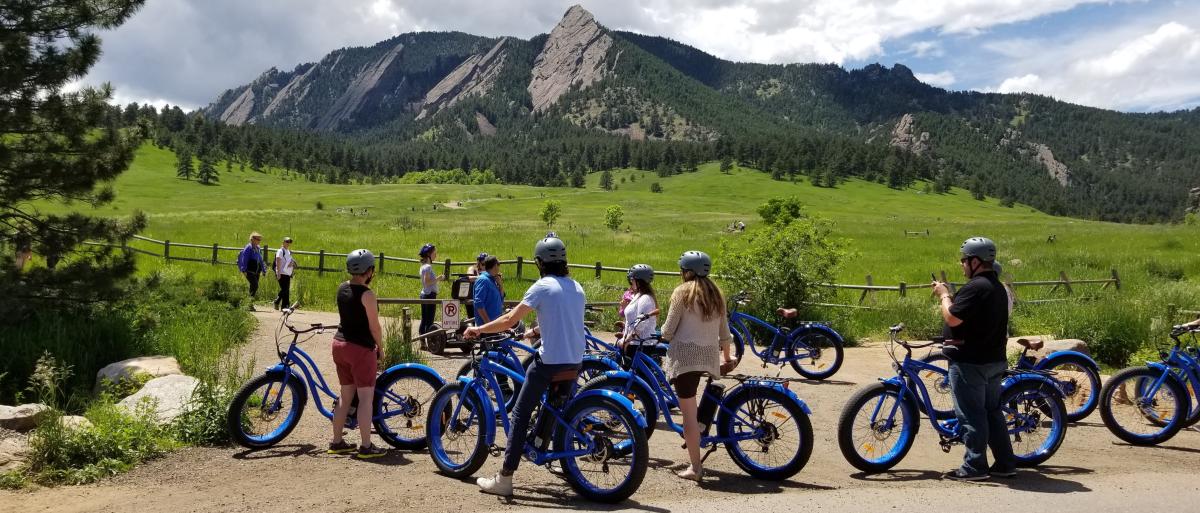 Group stopped to look at the Flatirons during a Electric Cruiser Bike Tour in Boulder