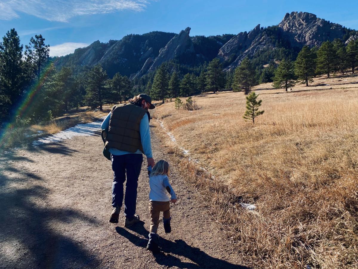 A family goes hiking in winter at Chautauqua in Boulder